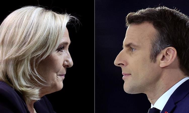L&atilde;nh đạo đảng cực hữu Mặt trận Quốc gia Marine Le Pen (tr&aacute;i) v&agrave; đương kim Tổng thống Ph&aacute;p Emmanuel Macron. Ảnh: Reuters. &nbsp;